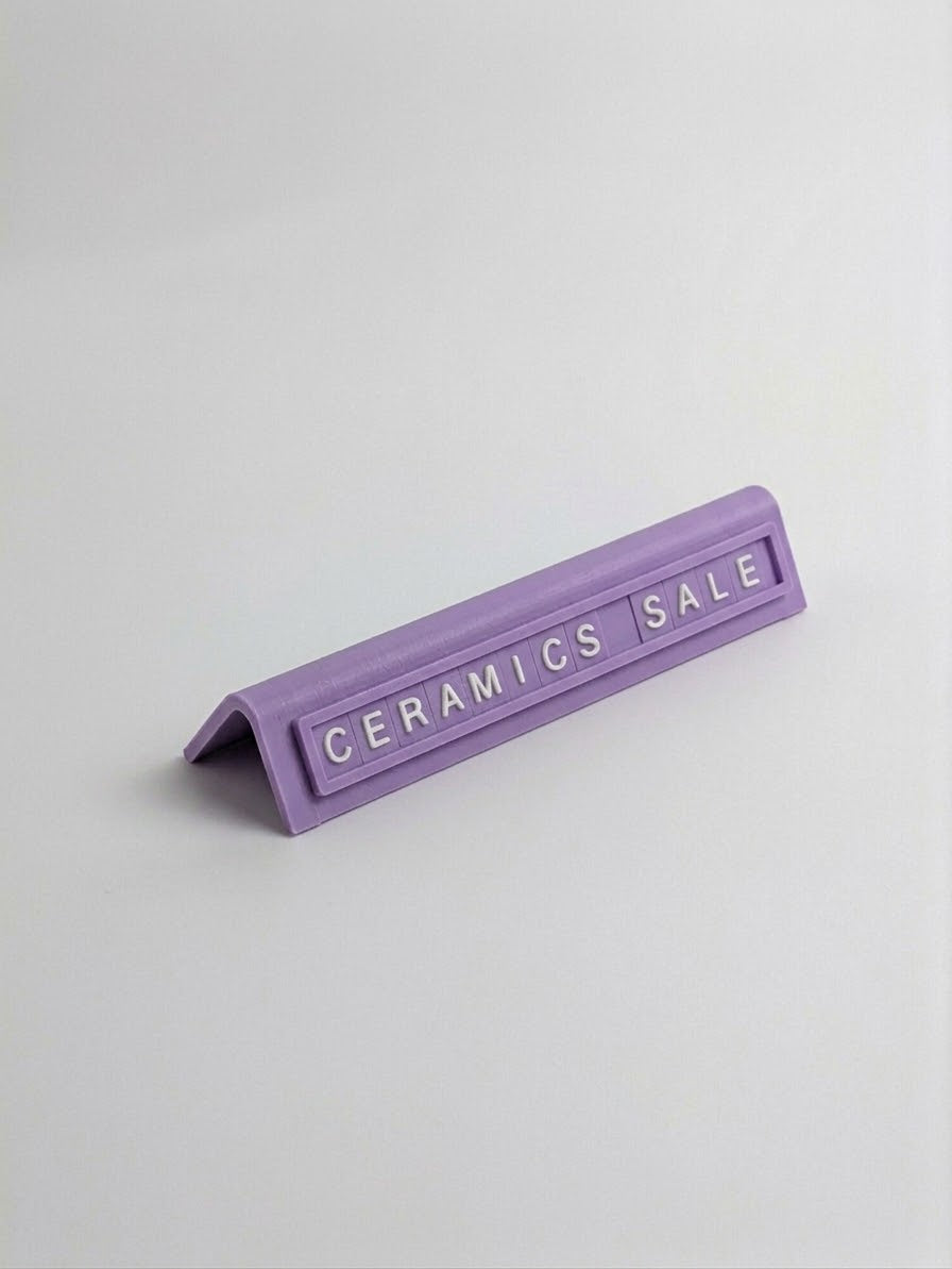 purple reusable countertop price sign for cafés and bakeries with interchangeable letter tiles