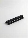 black reusable countertop price sign for cafés and bakeries with interchangeable letter tiles