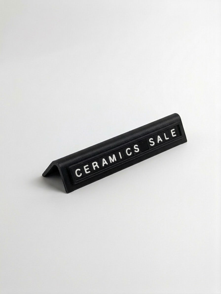 black reusable countertop price sign for cafés and bakeries with interchangeable letter tiles