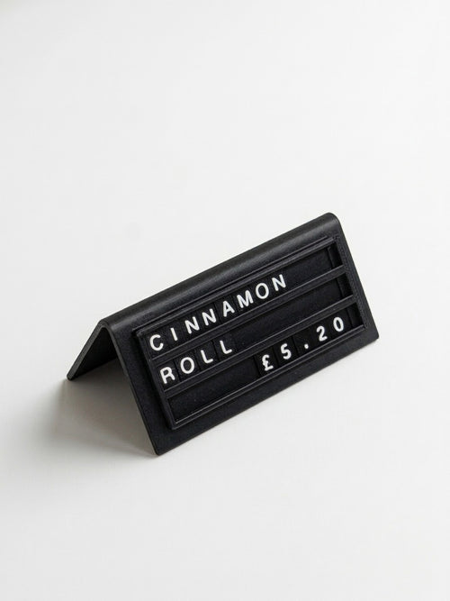 Black reusable countertop price sign for cafés and bakeries with interchangeable letter tiles